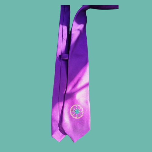 Purple tie with logo for Boarshaw Community Primary School