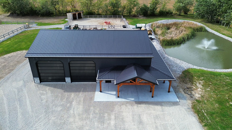 Aerial view of construction projects including a large shop.