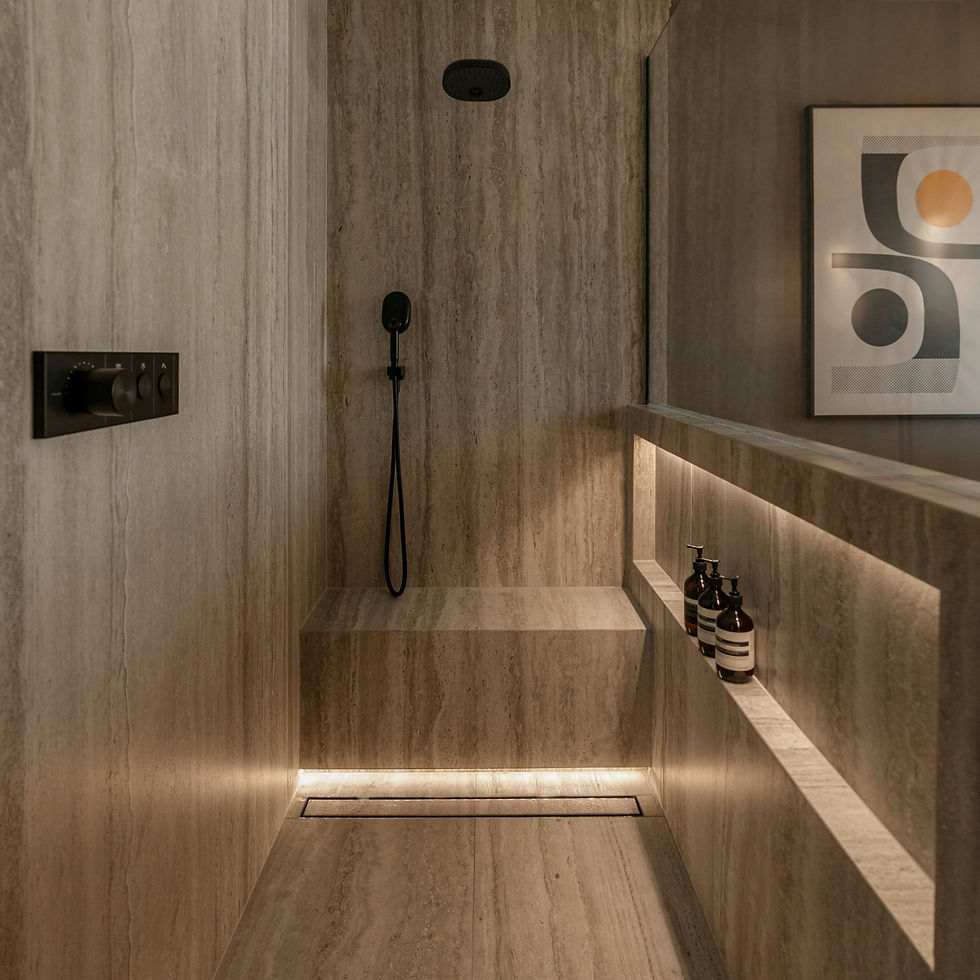 Luxurious bathroom remodel with natural, sealed, travertine stone in a modern home