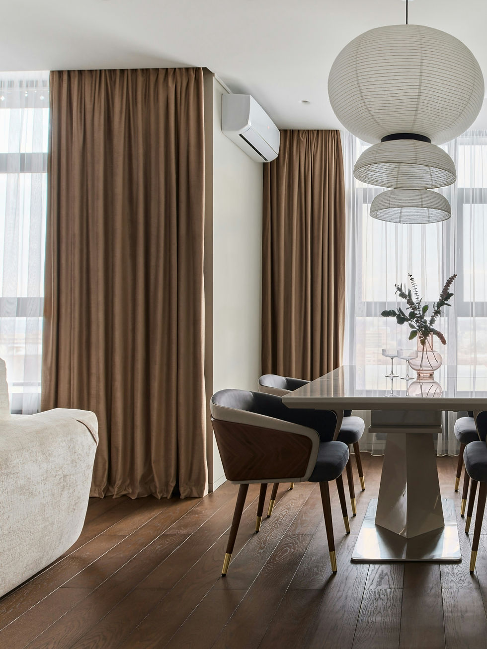 Luxurious floor to ceiling curtains in a modern condo in the city