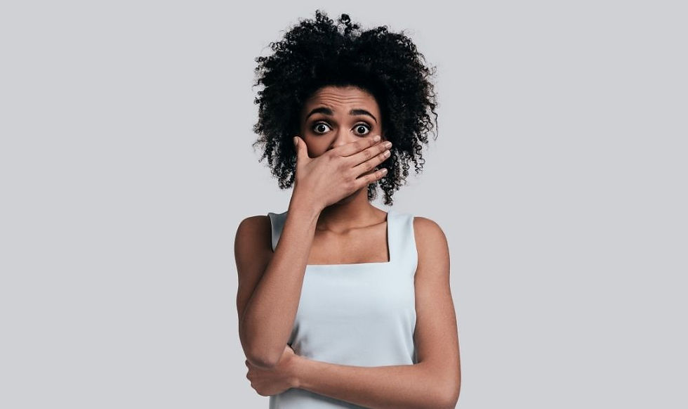 A woman covering her mouth