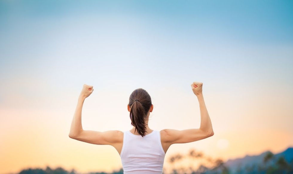 A woman showing her arm muscles