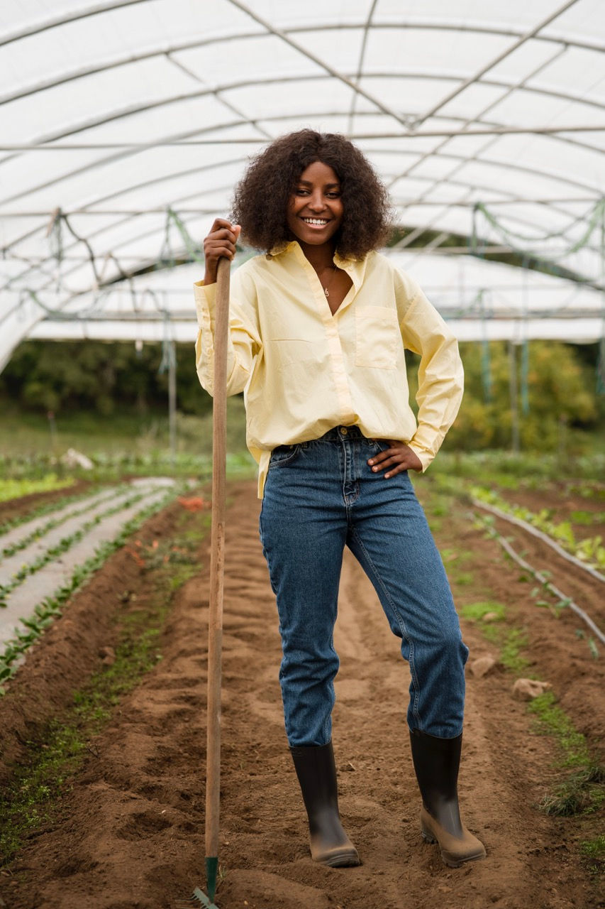 full-shot-smiley-woman-working Large.jpeg