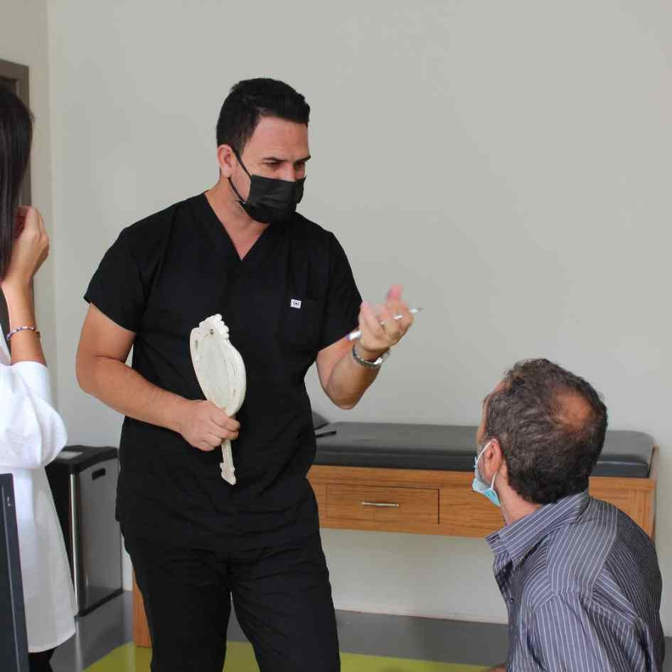 Dr Kinyas during a hair transplant consultation