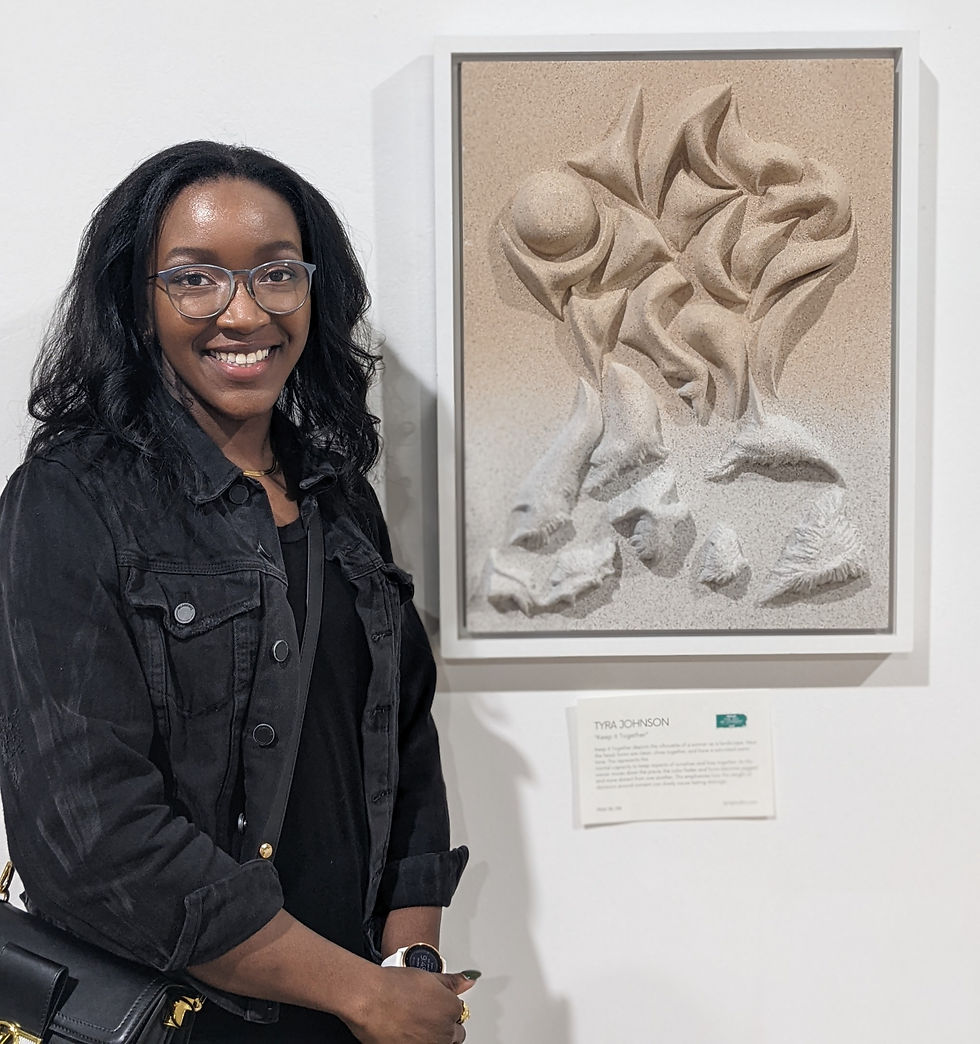 artist Tyra Johnson with sculpture