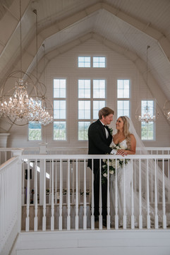 whitewashed barn for bridal portraits at providence vineyard, northern illinois wedding venue