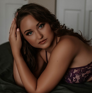 confident women embracing her femininity during a boudoir session