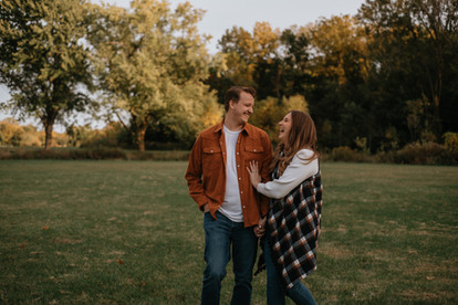 soon to be husband and wife making each other smile during their engagement session at busse woods schaumburg illinois