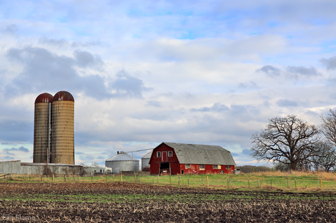Wisconsin Farmland with Clouds and Red Barn