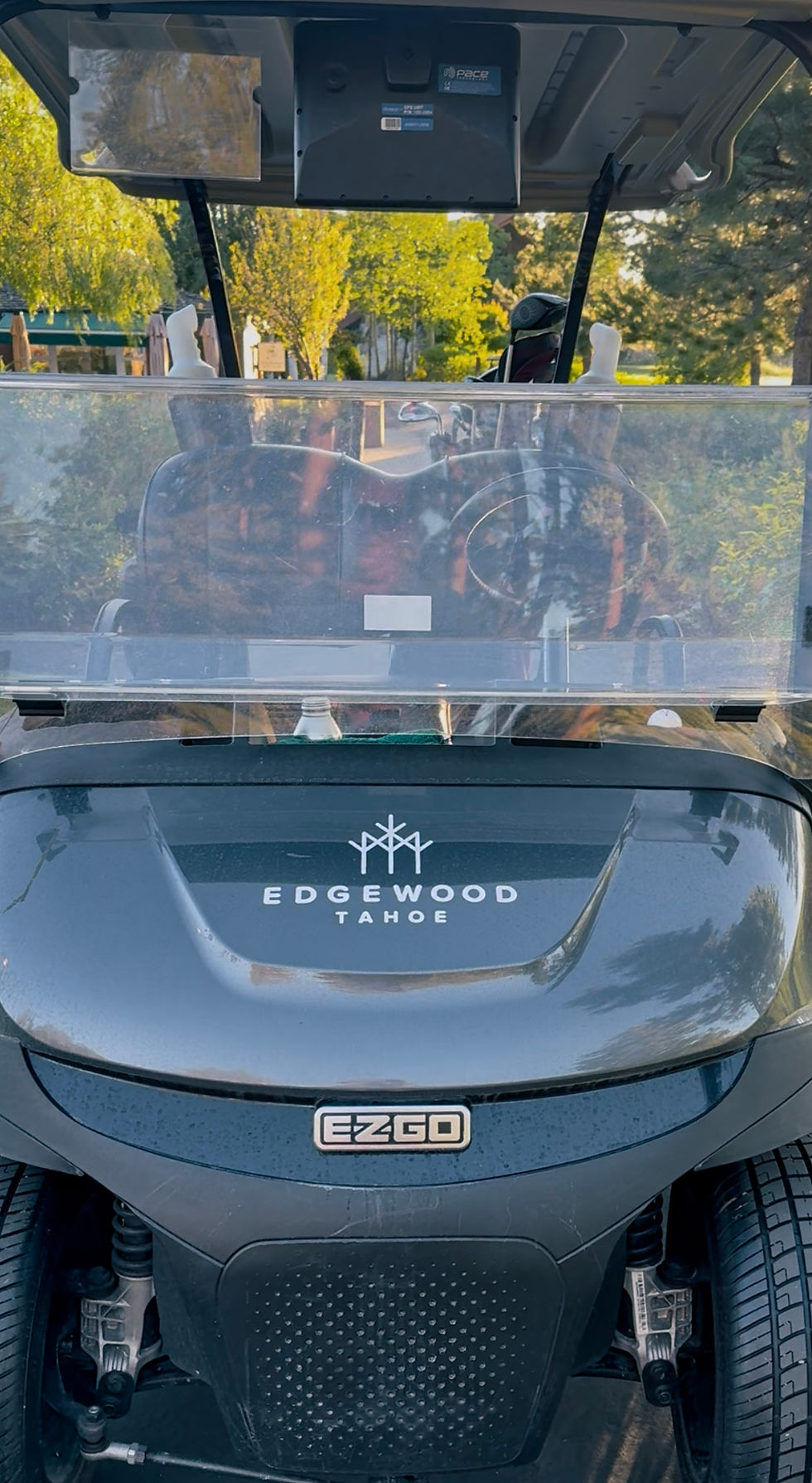 Edgewood-branded golf cart featuring plush, cushioned seats and a sleek, modern design.