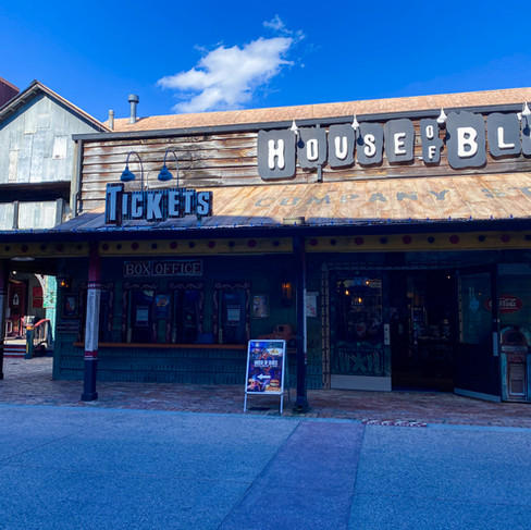 Exterior of House of Blues in Orlando, Florida at Disney Springs with rustic wooden facade and blue sky, travel inspiration photo from Orlando trip that sparked a 50-state goal.
