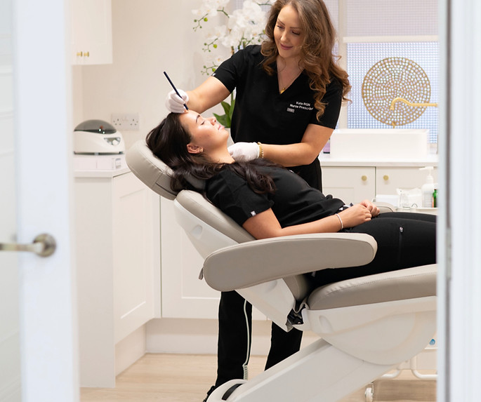Kate Plowes, aesthetic nurse prescriber, treating a client with Radiesse in a clinic chair, Lytham
