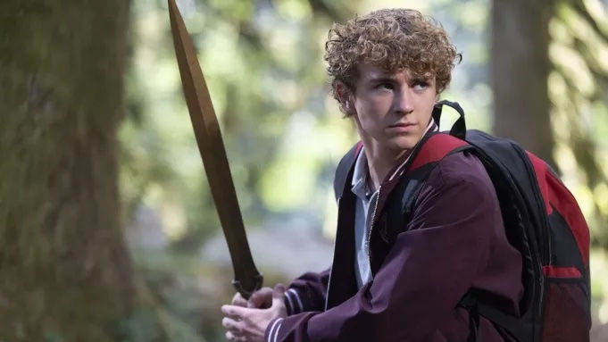 Walker Scobell as Percy Jackson brandishing a sword in 'Percy Jackson and the Olympians' season two. 