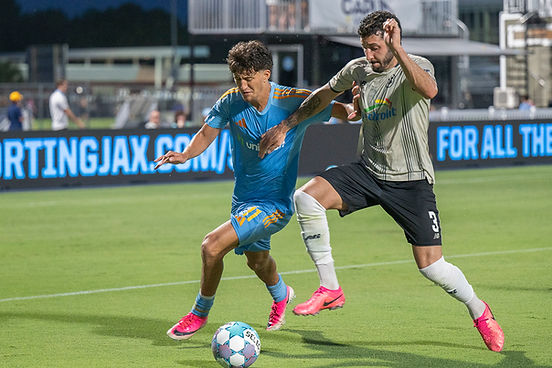 Sporting Jax forward Ahmad Al-Qaq (11) dribbling the ball against Brooklyn FC defender Gabriel Alcides Alves (3) during the second half of a USL Championship League soccer match on Saturday, July 18, 2026, in Jacksonville, Fl... (Photo/Michael Hornstein)