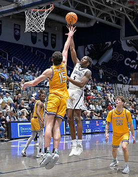 Dorian James, UNF, scoring over Dylan Faulkner, Lipscomb University