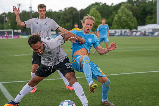 Sporting Jax midfielder Rafferty Pedder (19) fighting for the ball against Brooklyn FC defender Thomas Vancaeyezeele (92) during the second half of a USL Championship League soccer match against Brooklyn FC defender Ryan McLaughlin (23) during the first half of a USL Championship League soccer match on Sunday, May 31, 2026, in Jacksonville, Fl..