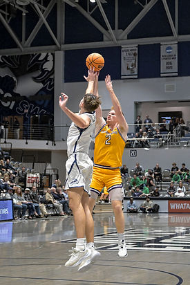 UNF's Nate LlIteras guarding Lipscomb's Will Pruitt