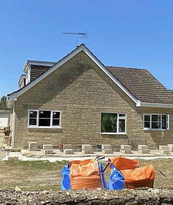 Building site brickwork and scaffold house and roof