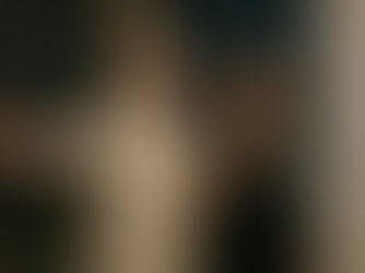 Couple celebrating at winter party with Christmas tree and festive decorations