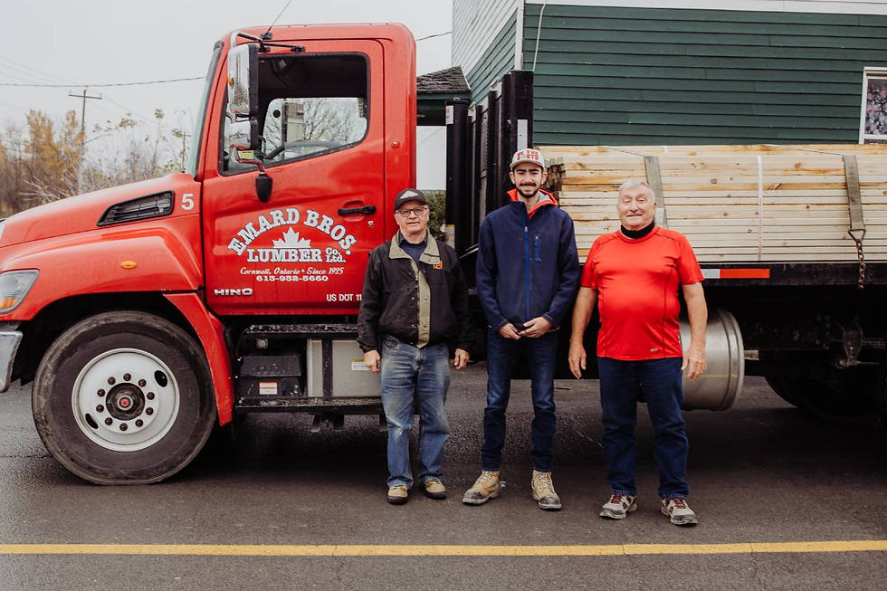 3 people in front of a truck