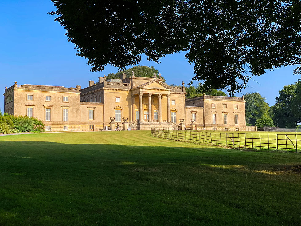 The honey gold Palladian exterior of Stourhead House