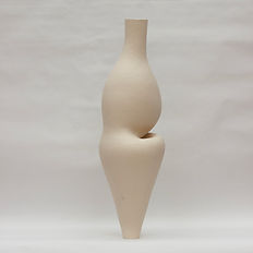 Large off-white ceramic vessel with an inner curve and overhanging belly, standing tall against a white background.