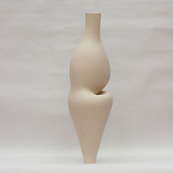 Large off-white ceramic vessel with an inner curve and overhanging belly, standing tall against a white background.