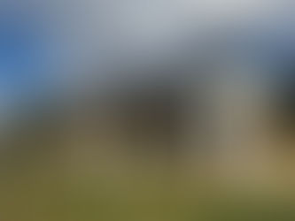 White tasting room building on vineyard property