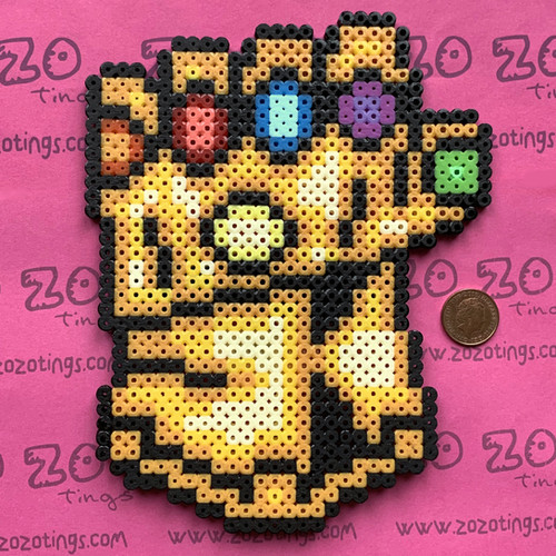 Buy our Thanos 'Infinity Gauntlet' Christmas Tree Topper brought to you