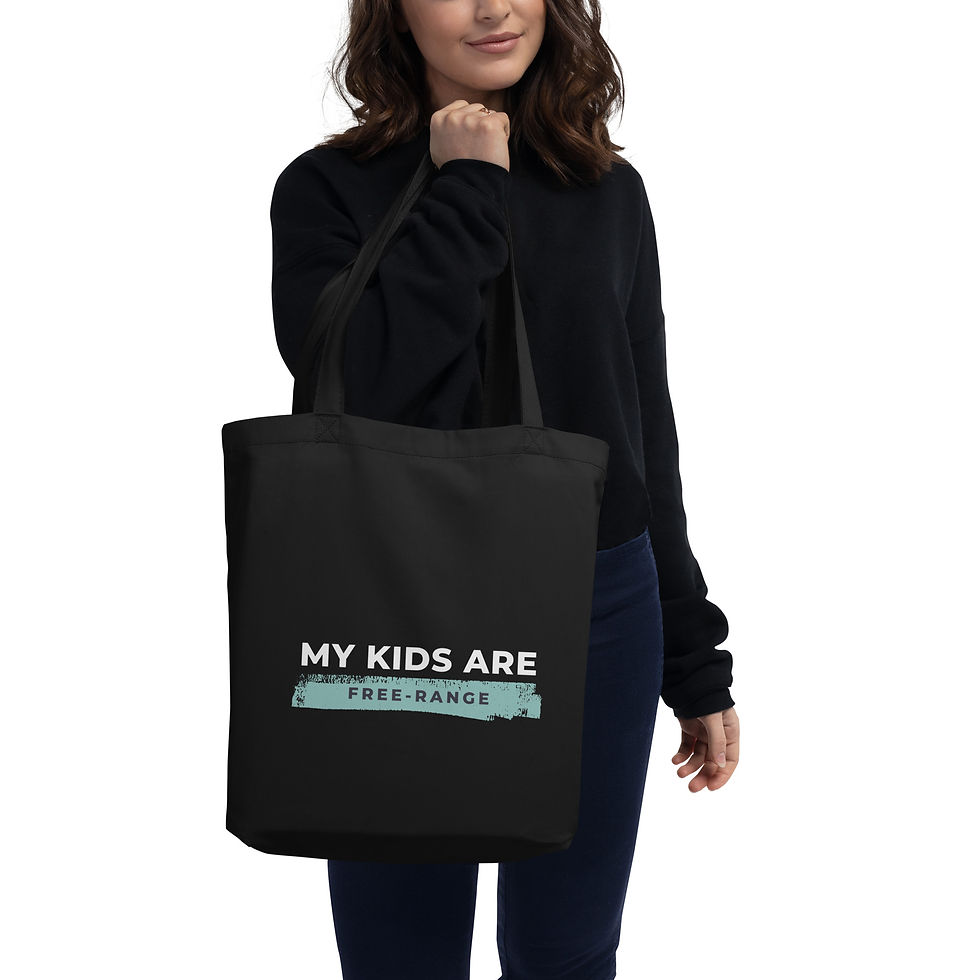 Black My Kids Are Free-Range tote bag carried by woman, eco-friendly mum accessory