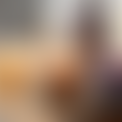 Three lit natural candles in glass jars with dried lavender, creating a cozy low-tox home atmosphere.