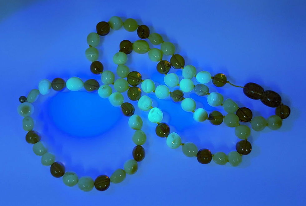 Thumbnail: Baltic Amber necklace and bracelet combo 14 inches under a UV light