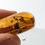 Thumbnail: Amber With Insects #271 • Clear Termite Wing With Detritus 
