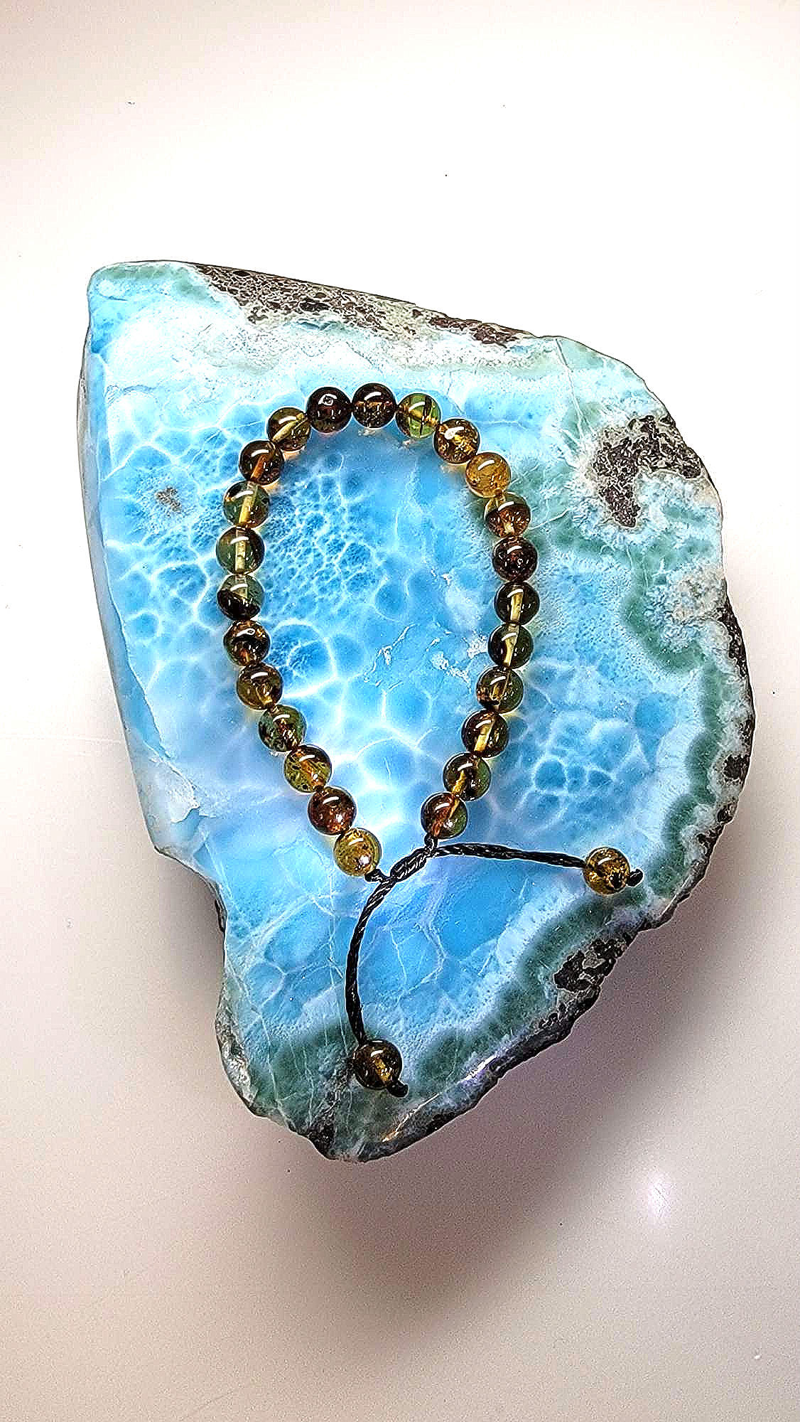 Dominican amber bracelet over larimar stone