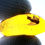 Thumbnail: Dominican Amber with mosquito inclusion held between two fingers