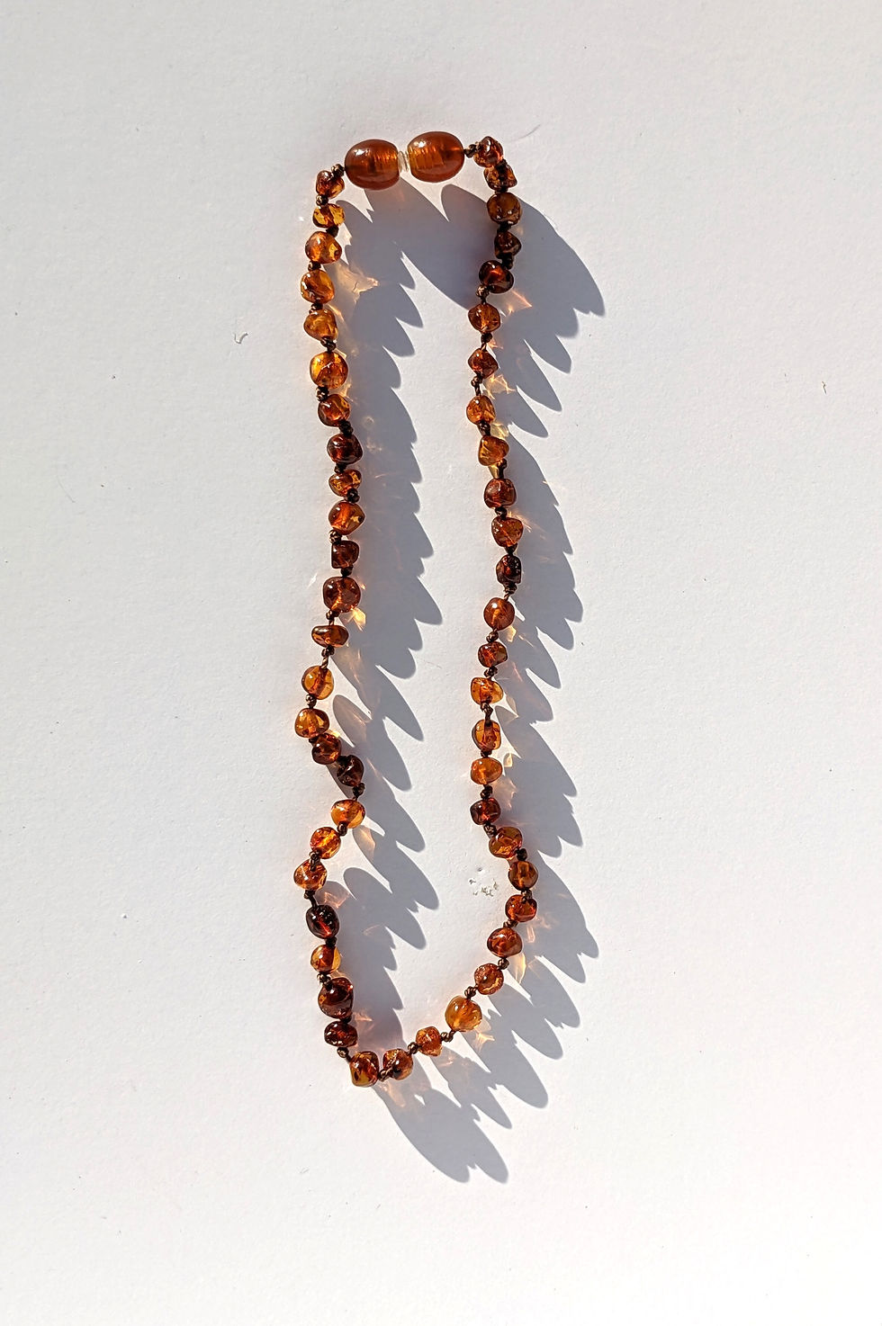 Thumbnail: Authentic 11 inch red baltic amber painkilling teething necklace with a screw clasp