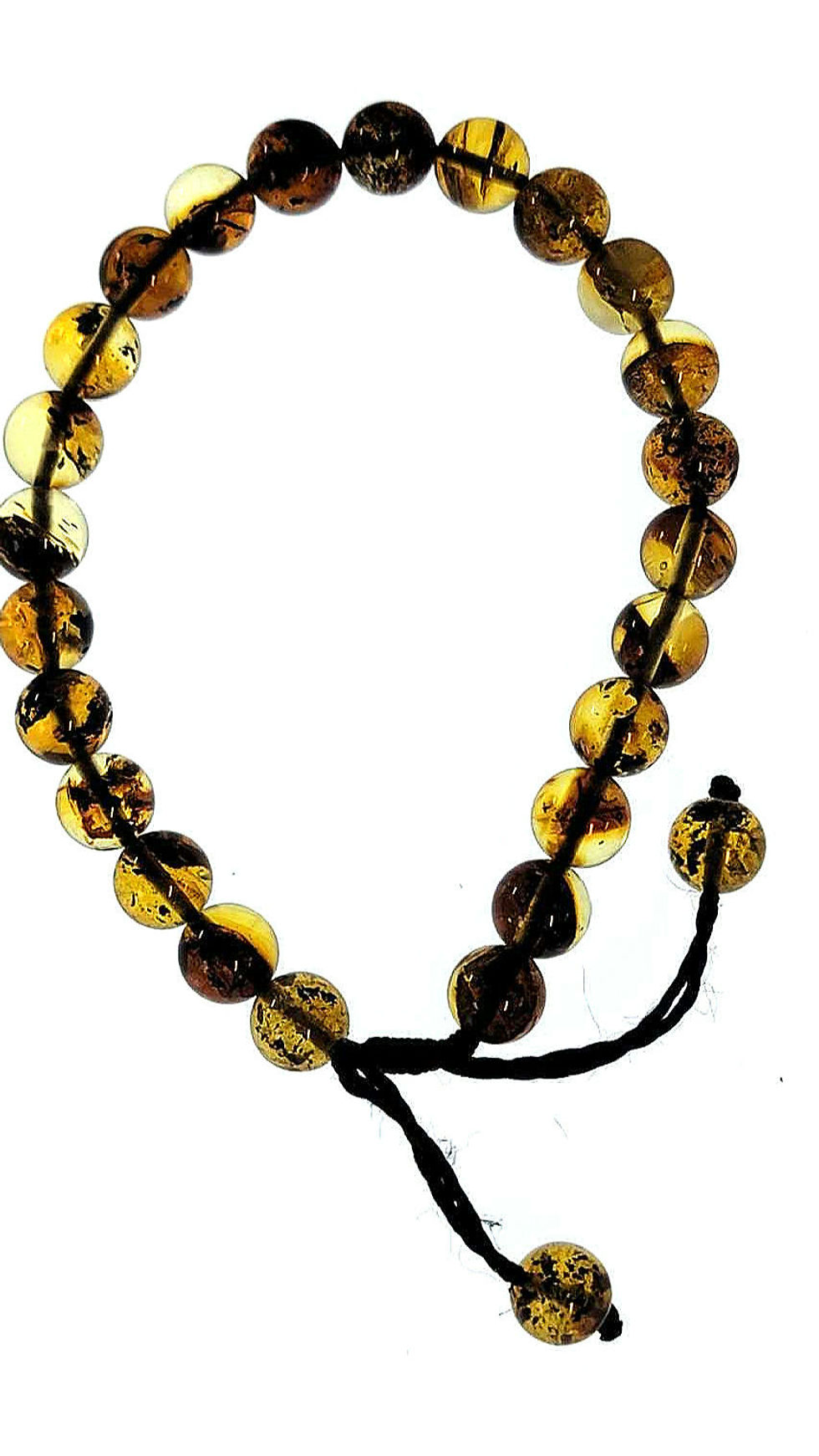 Dominican amber bracelet under light board