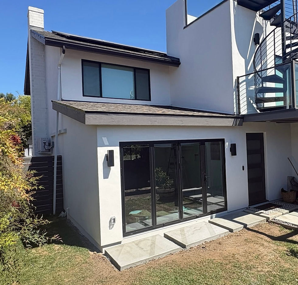 Home extension of a covered closed patio with large glass french doors built by Sam Hoyer Construction in San Diego