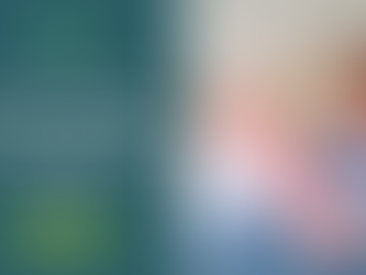 Elderly woman exercises with a red resistance band, assisted by a smiling man in scrubs. 