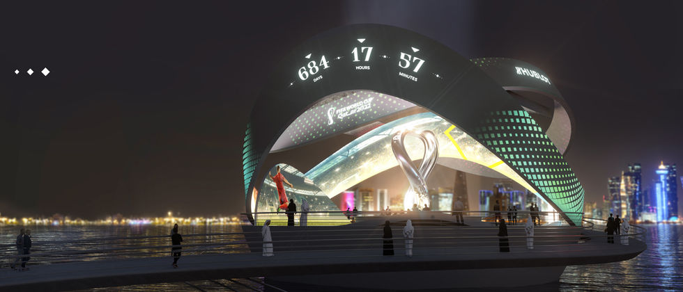 Countdown Clock World Cup 22: Nächtliche Visualisierung mit grün-türkisen Projektionen auf den großen Schleifenflächen.