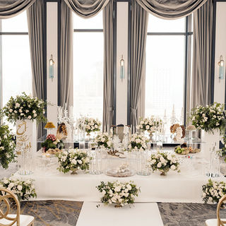 White and silver Sofreh Aghd in San Francisco with glass base details, soft florals, and an elegant ceremony setup