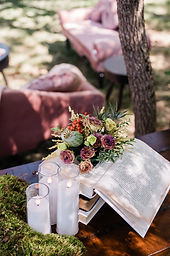 Elegant centerpiece featuring an open book adorned with fresh flowers, perfect for event styling.