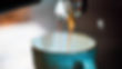Coffee being poured from coffee machine