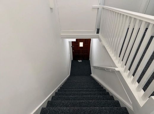 Looking down the stair to the front door