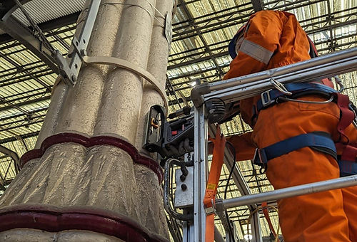 Worker carrying out specialised onsite drilling