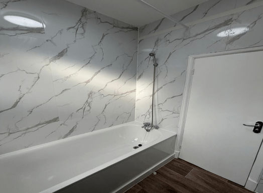 a bath with an overhead shower