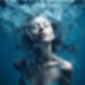 Female swimming in coherent water