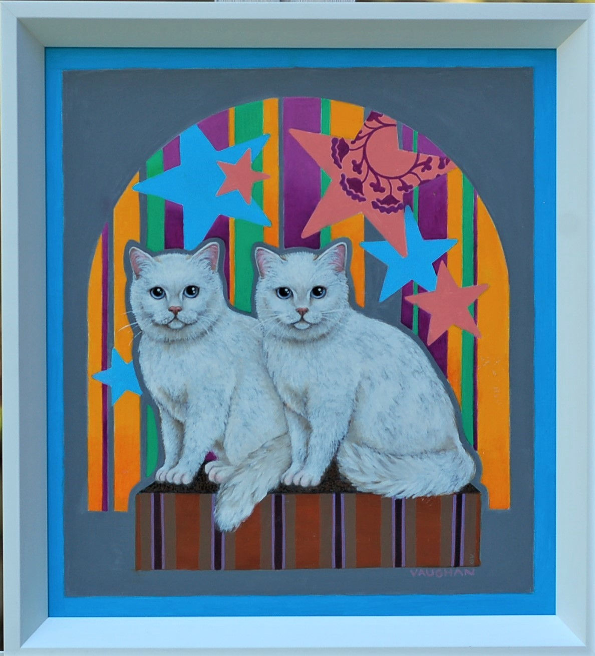 Two white cats sitting on a striped surface, stars and colorful stripes in background