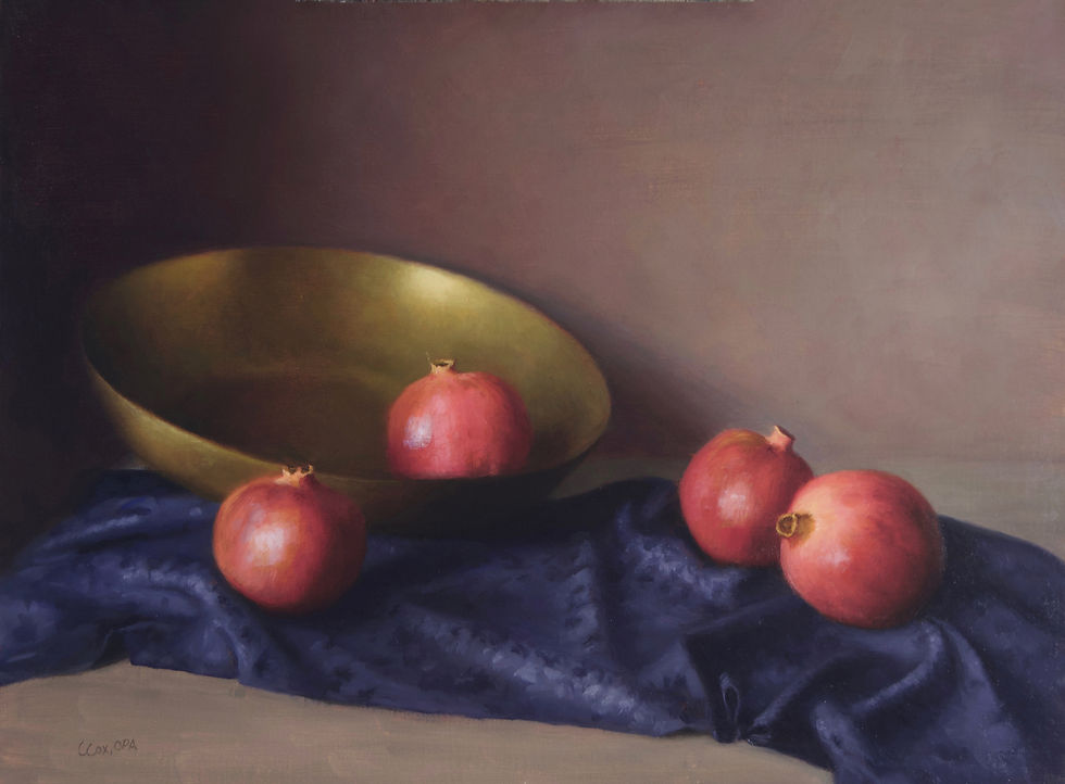 pomegranates falling out of a golden bowl