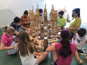 Kapla with teenagers in camp